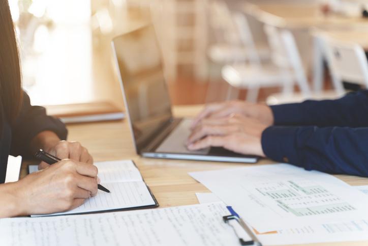 istock image of two people working at a table
