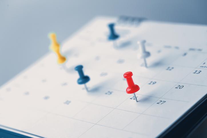 istock image of push pins on a calendar